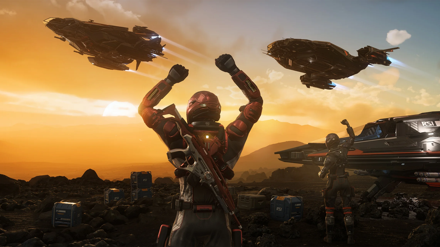Deux joueurs de Star Citizen saluent le passage de vaisseaux RSI au coucher du soleil, entourés de caisses pendant l'événement RSI Discovery Month